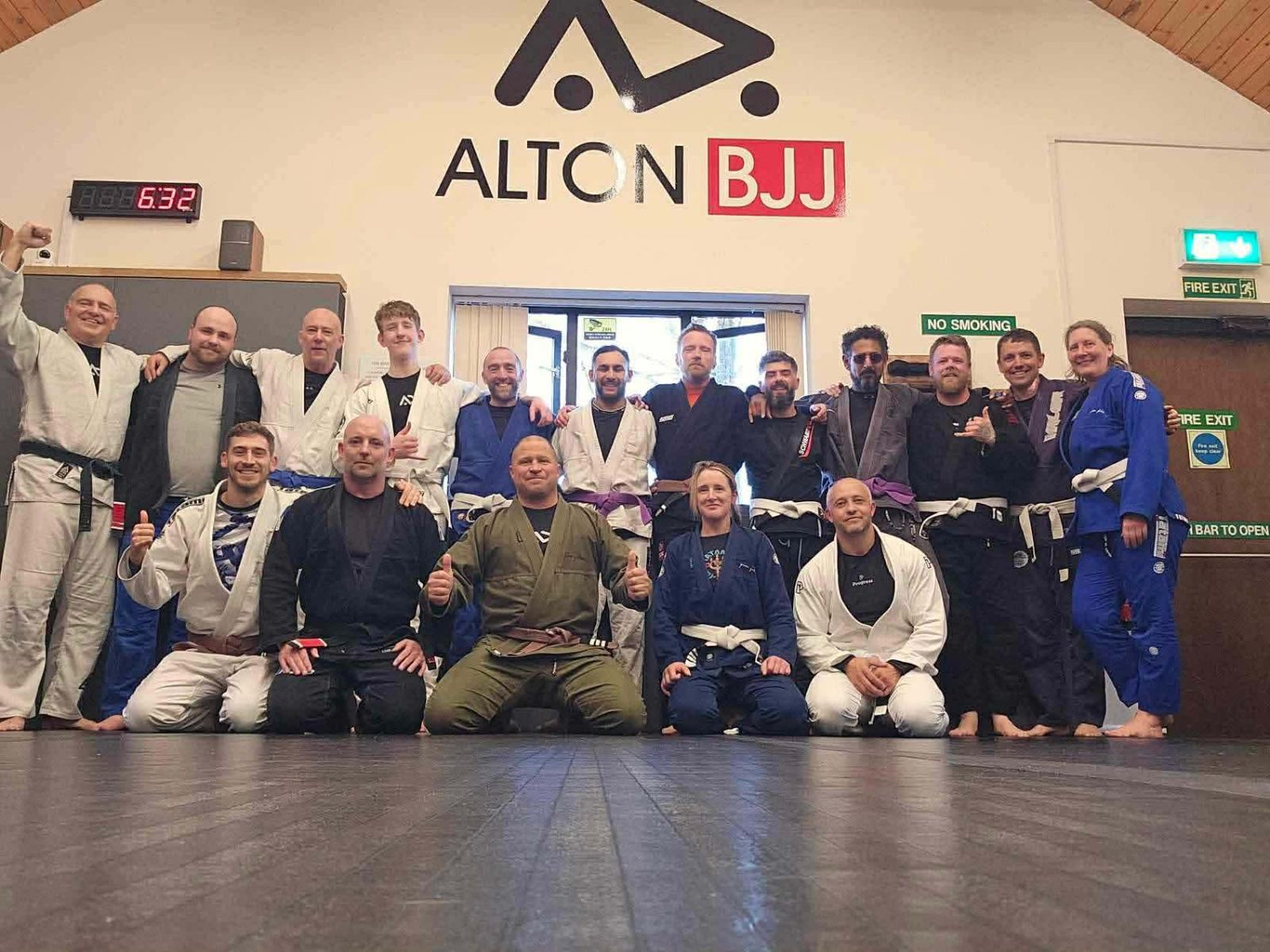 The club under the Alton BJJ wall logo