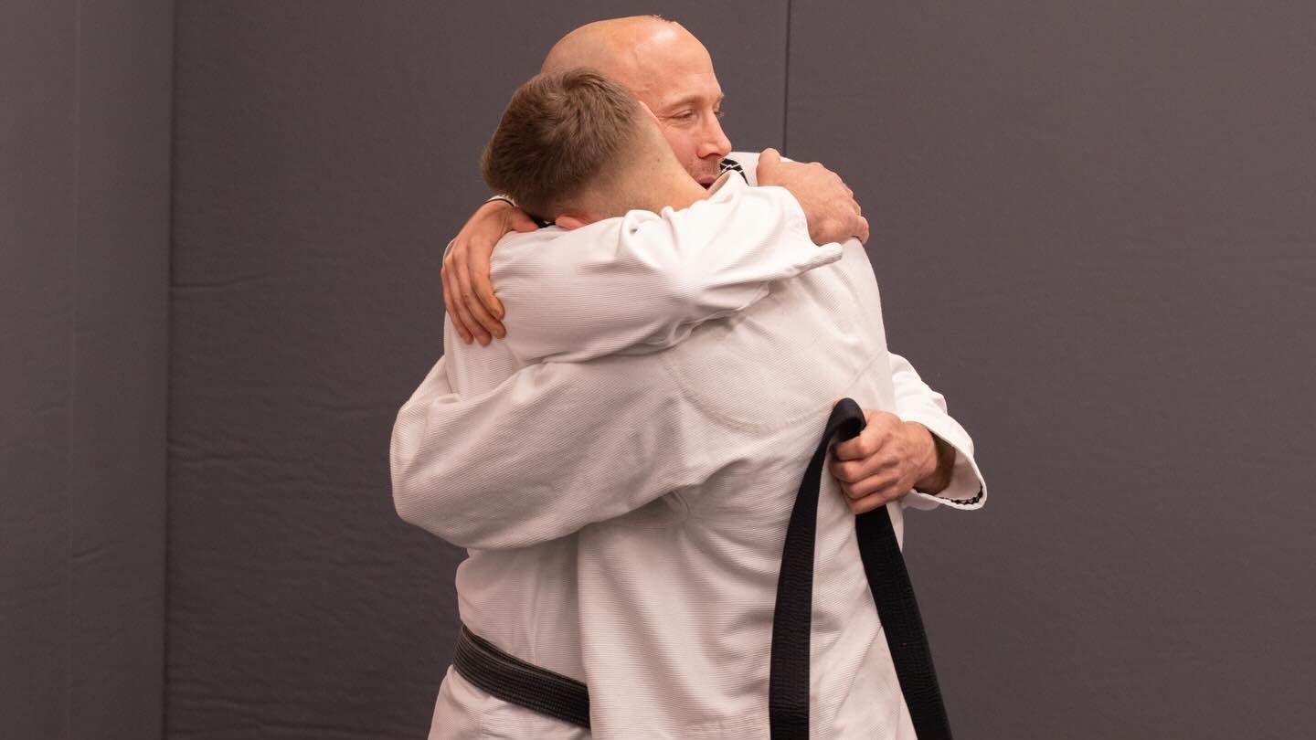 A belt promotion moment on the mats